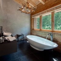 White bathtub on the black floor