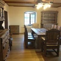 Wooden furniture in the dining room of the country house