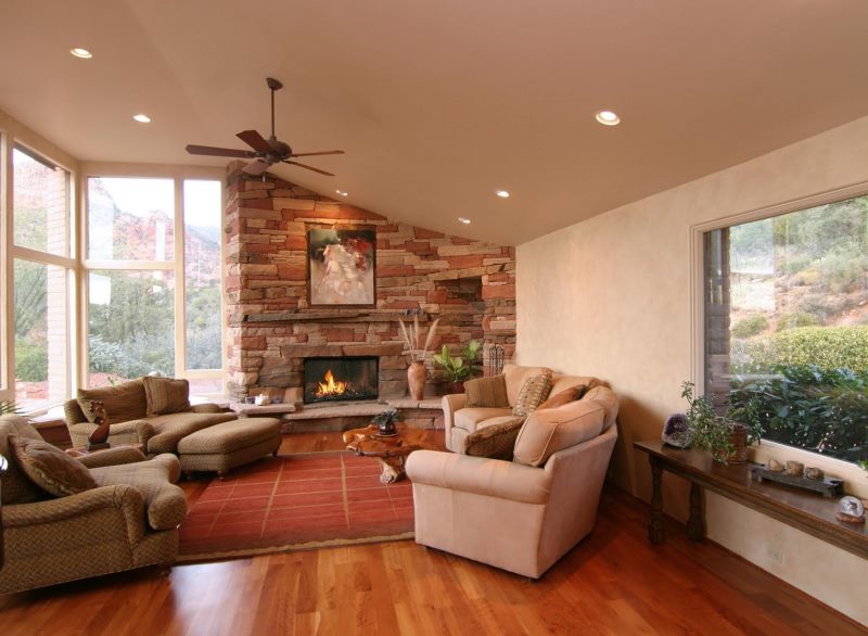 Stone fireplace in the interior of the living room of a private house