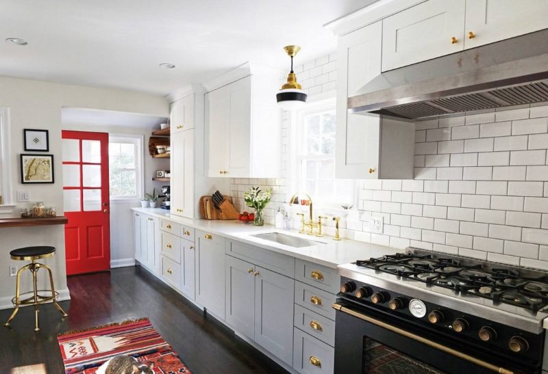 Red door in a white kitchen