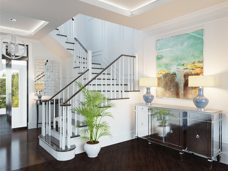 Staircase with dark steps in the hall of the townhouse