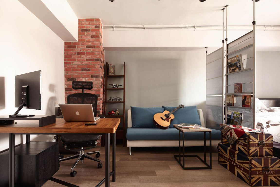 Laptop table in a loft style studio apartment