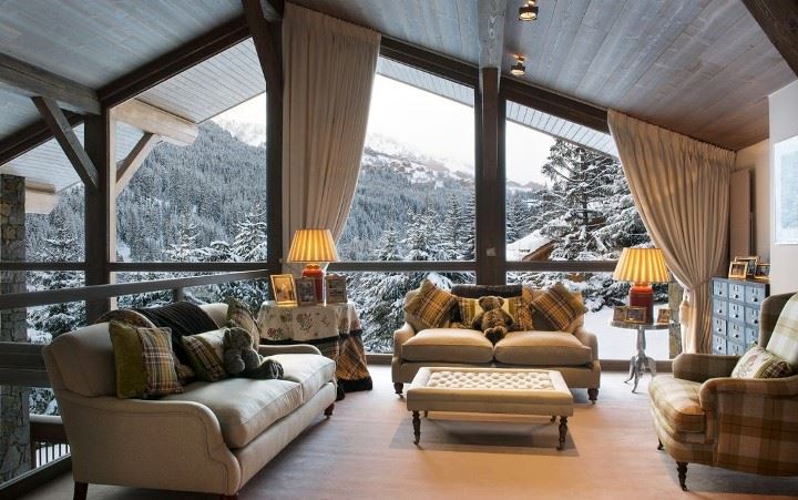 The interior of a spacious living room in the attic of a private house