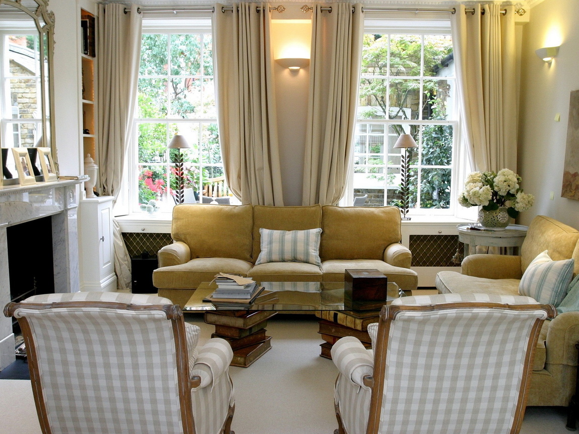 Decorative lamps in a living room with two windows