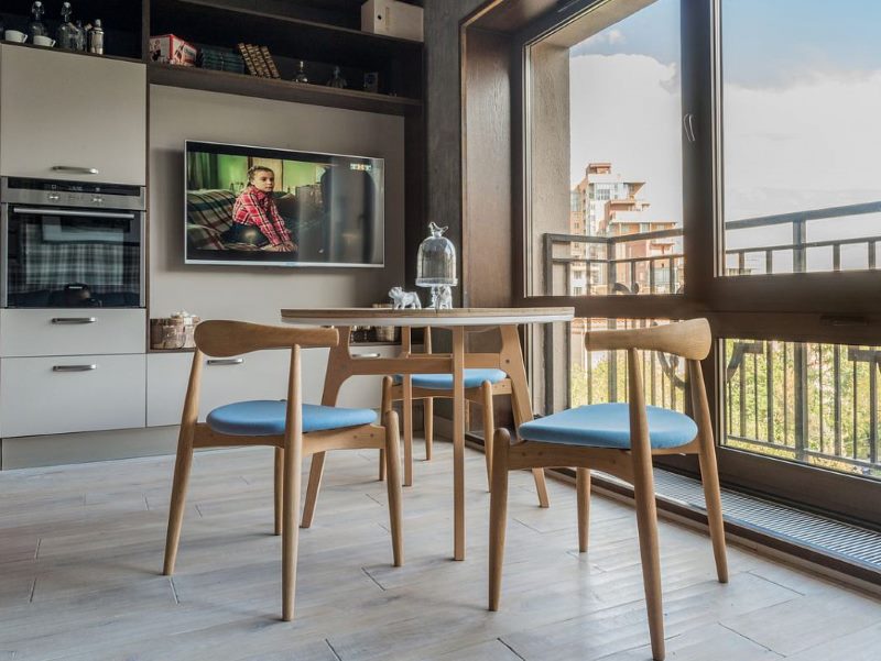 Dining table in front of panoramic windows