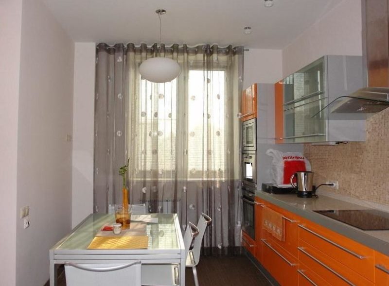 Transparent faux fabric curtains in a high-tech kitchen