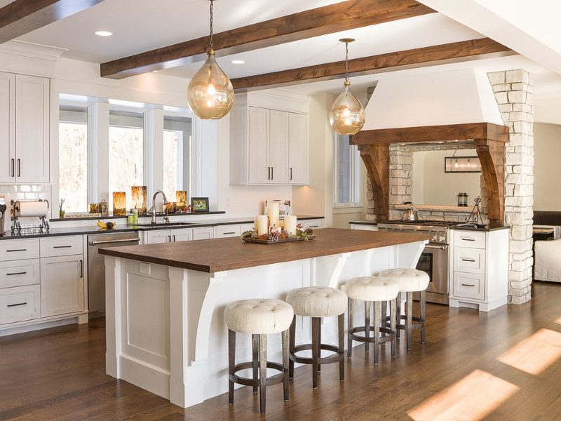 Wooden beams on the white ceiling of the kitchen