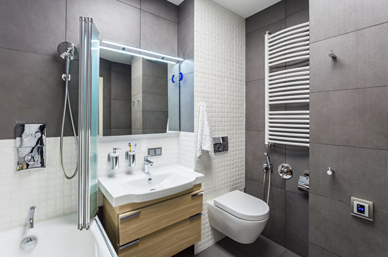 Gray tile in the bathroom with a hanging toilet