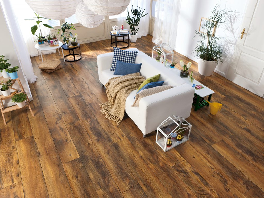 Boardwalk in a bright living room with a white sofa