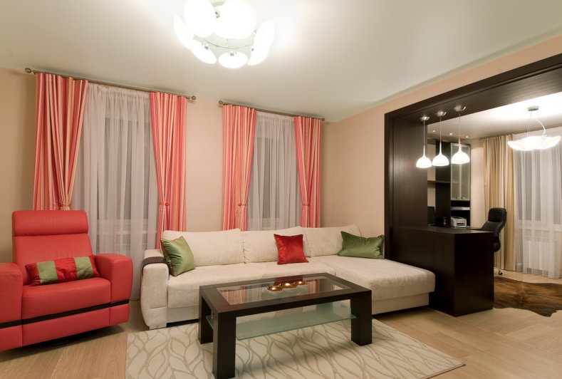 Pink curtains with stripes on the windows of a modern living room