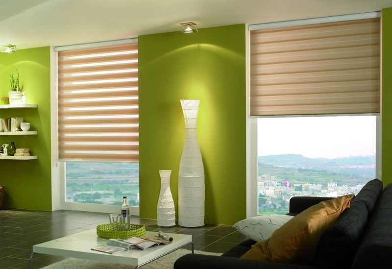 White decorative vases on a background of green wall