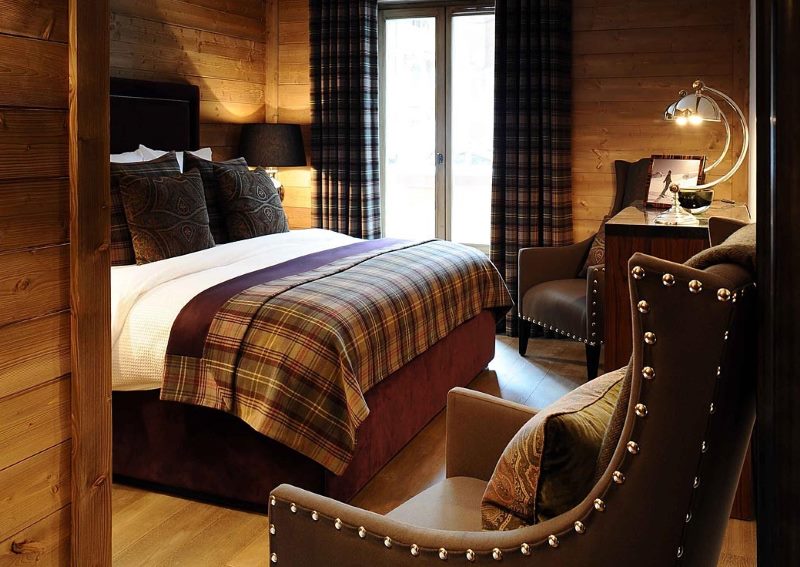 Armchairs with metal rivets in the bedroom of a private house