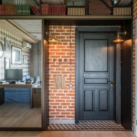 Entrance door in an industrial style studio apartment