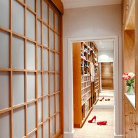 Women's high-heeled shoes in a narrow corridor