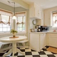 English curtains on the windows of the kitchen-dining room