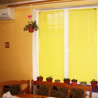 Yellow blinds made of plastic slats