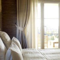 Pillows with snow-white pillowcases on the bed of spouses