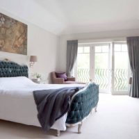 Gray bedspread on a white bed