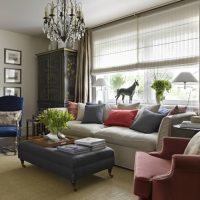 Multi-colored pillows on a light gray sofa