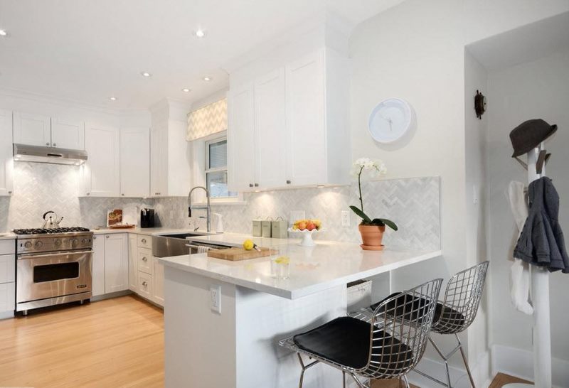 Interior of a modern corner kitchen in white