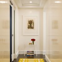 Carpet with a yellow ornament on a dark floor