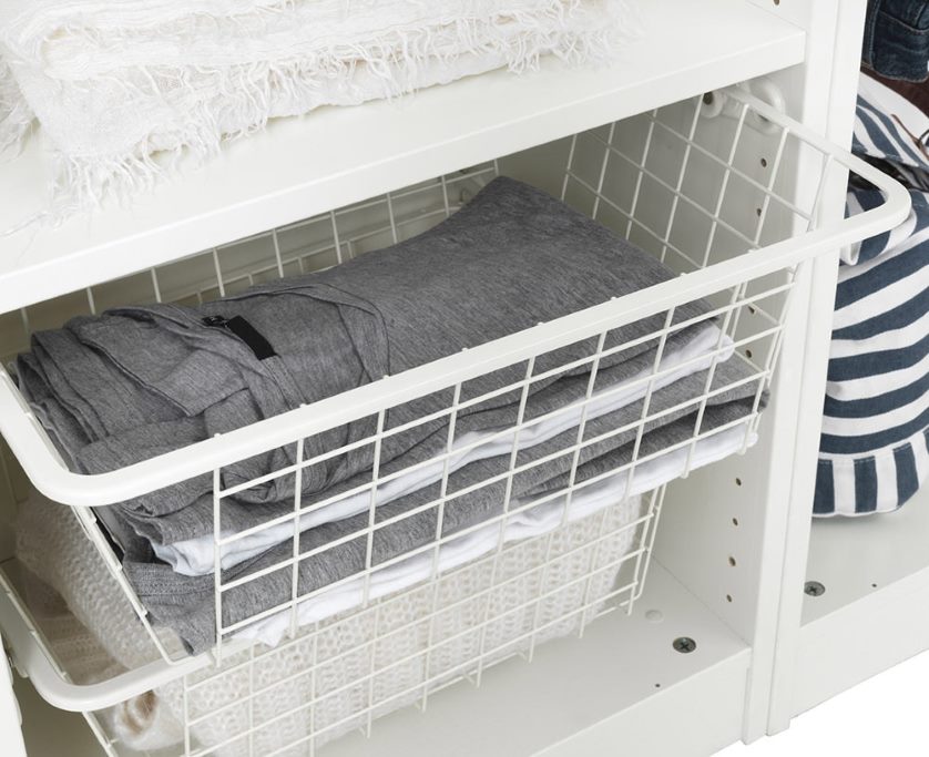 Storage baskets in a corner cupboard