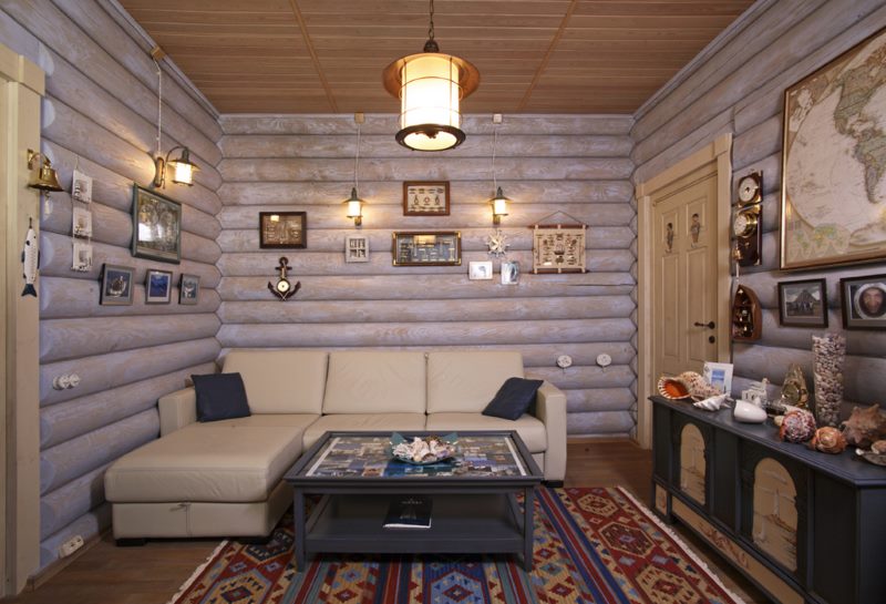 Beige corner sofa in the living room with log walls