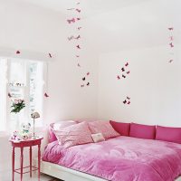 Pink butterflies in a white nursery