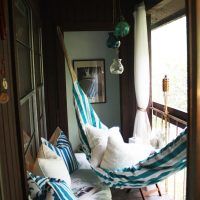 Hammock on the balcony with wood paneling