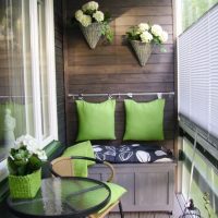 Green pillows on a wooden wall