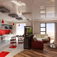 Red color in the interior of the kitchen-living room