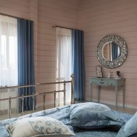 Blue curtains in the bedroom of a young girl