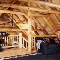 Sofa under the wooden slopes of the attic