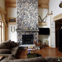 High-ceilinged rubble stone fireplace