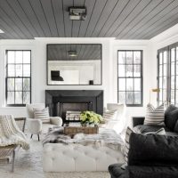 Gray ceiling in a living room with white walls