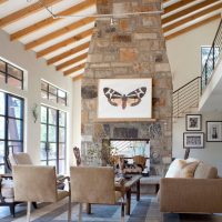 A fireplace in the middle of the living room in a country cottage