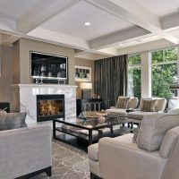 Fireplace in the living room with large windows.