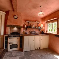 Kitchen of a rural house with access to the courtyard