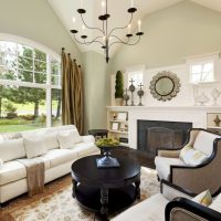 White sofa in front of a private house garden window