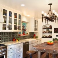 Forged lamp on the ceiling of the kitchen