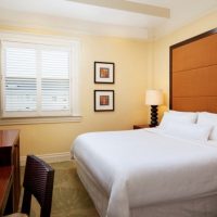 The interior of the bedroom with yellow walls