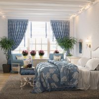 Flowers on the windowsill of a bedroom in a private house