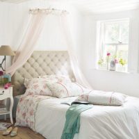 A small window in the bedroom of a country house