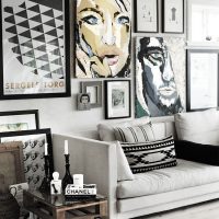 Wall decor over the sofa with posters and photos