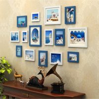 Blue frames with photos on beige wallpapers