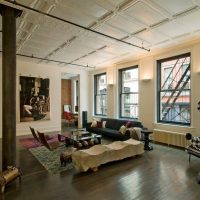 Bright ceiling in the apartment without partitions