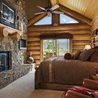 Bedroom interior with fireplace in a private house