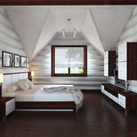 Design of a white bedroom in the attic of a private house