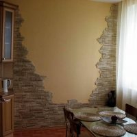 Decorative stone on the wall of a kitchen in a panel house