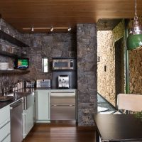 Dark stone in the interior of the kitchen of a private house